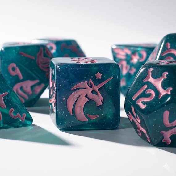 Unicorn Arcane dice set, teal resin with pink unicorn symbols